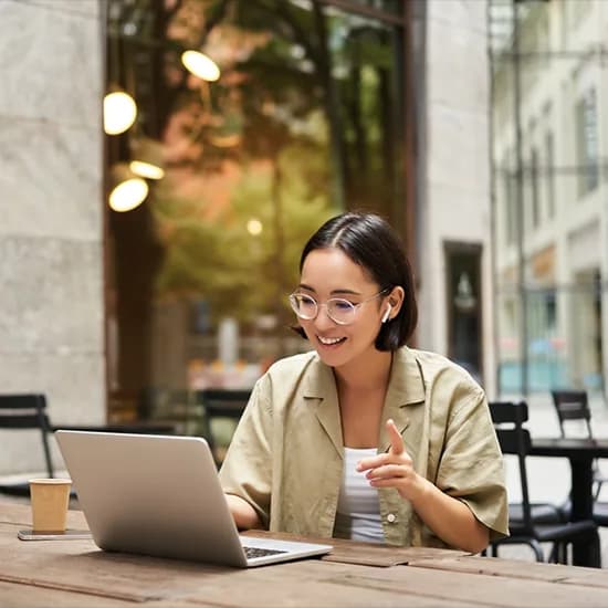 Finance team member reviewing invoice processing on a laptop
