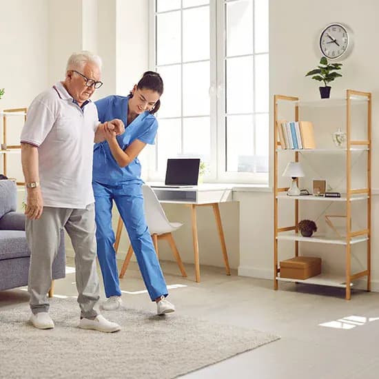 Hospice care worker supporting a patient in a bright care setting